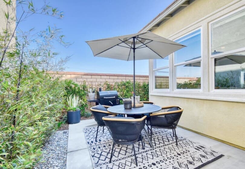 Outdoor dining table at Poppy Plan 2 at New Haven by Brookfield Residential in Ontario Ranch CA