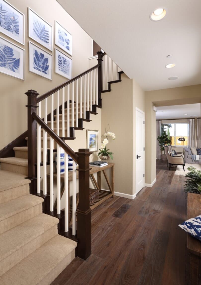 Gallery wall on a stairway in Merritt Residence 2 at Emerson Ranch by Brookfield Residential in Oakley CA