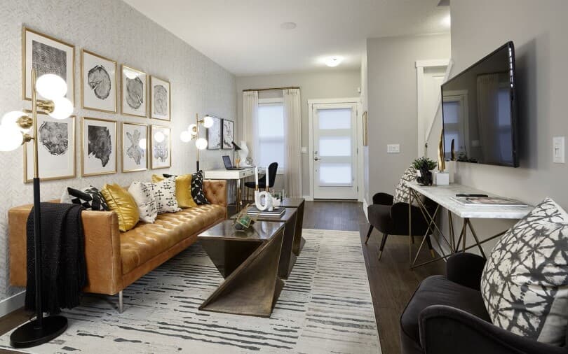 Living room in Plum in the Octave Collection at Livingston by Brookfield Residential in Calgary AB