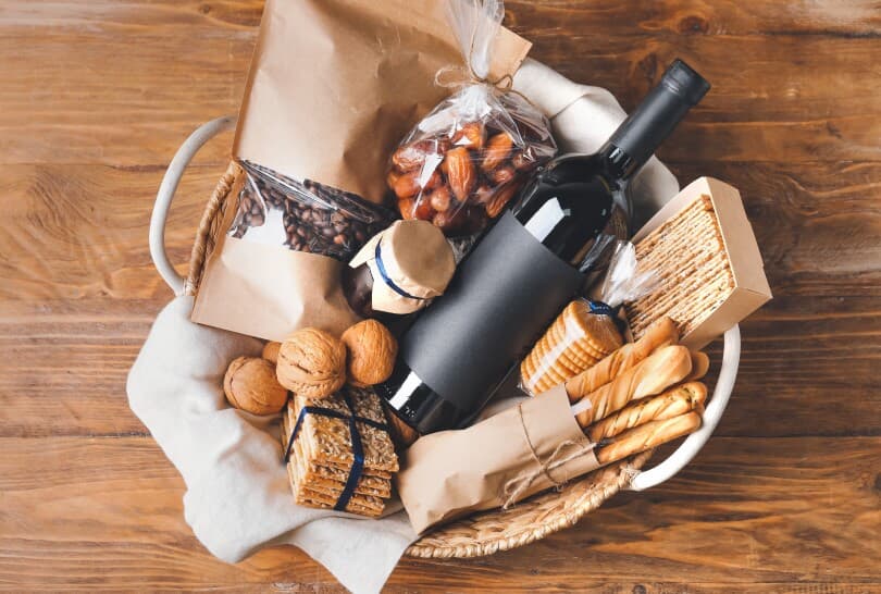 Gift basket with wine, crackers, and nuts