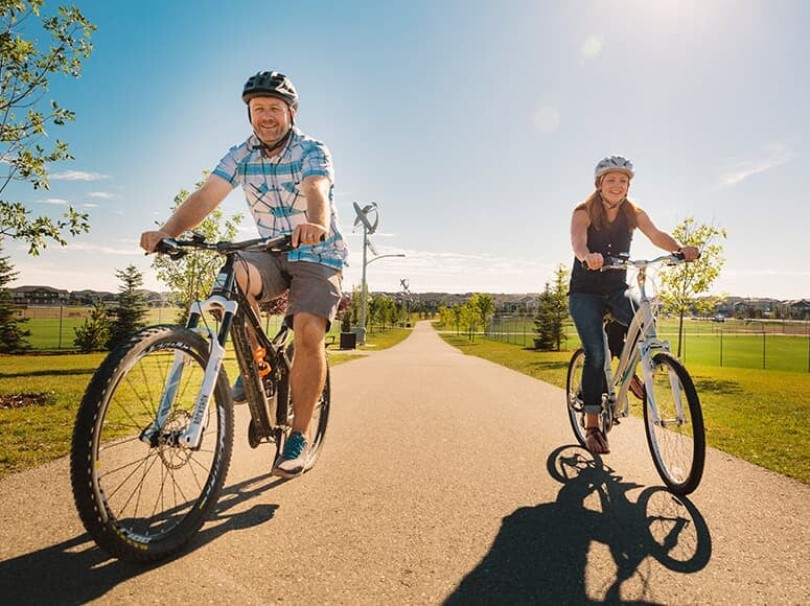 Couple on bikes at Chinook Gate in Calgary AB