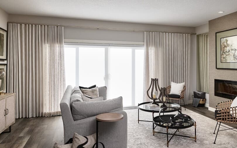 Wall to wall curtains in a living room in a Brookfield Residential home in Edmonton, AB
