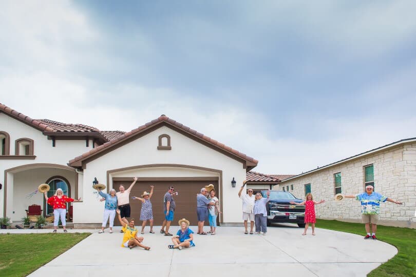 Neighbors having fun in the driveway of their Kissing Tree home by Brookfield Residential in San Marcos TX