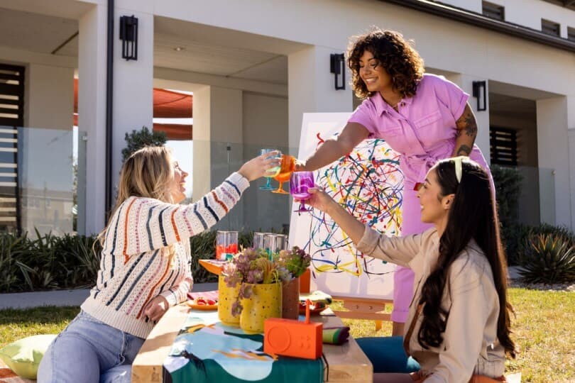 A group of women having a paint party at  New Haven by Brookfield Residential in Ontario