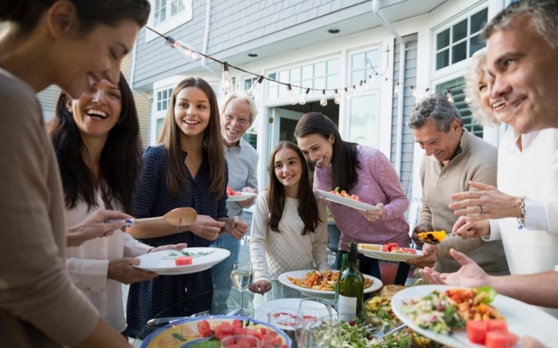 Friends and family gathering around food at their Brookfield Residential home