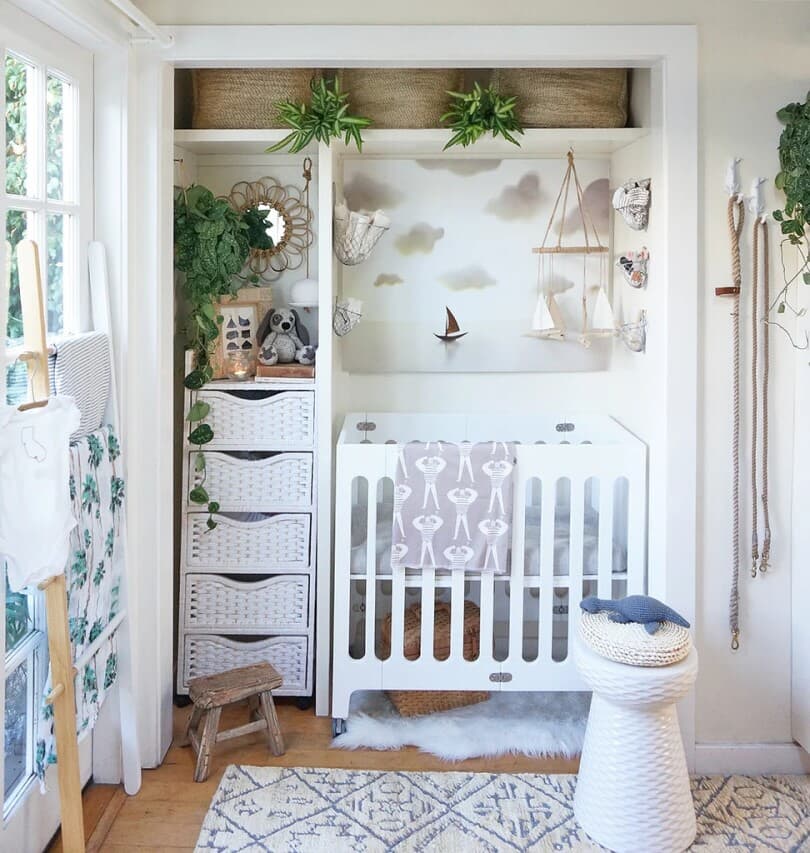 Crib and small nursery set up in a closet space