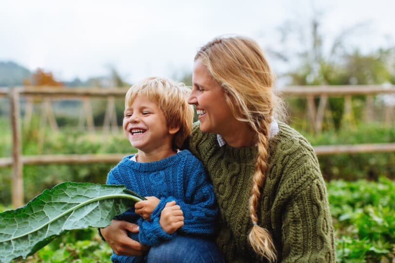 Mother and son in the community garden at Barefoot Lakes in Firestone CO