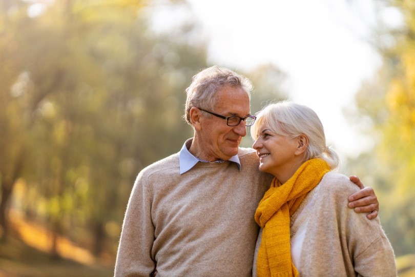 Happy older couple in an autumn park