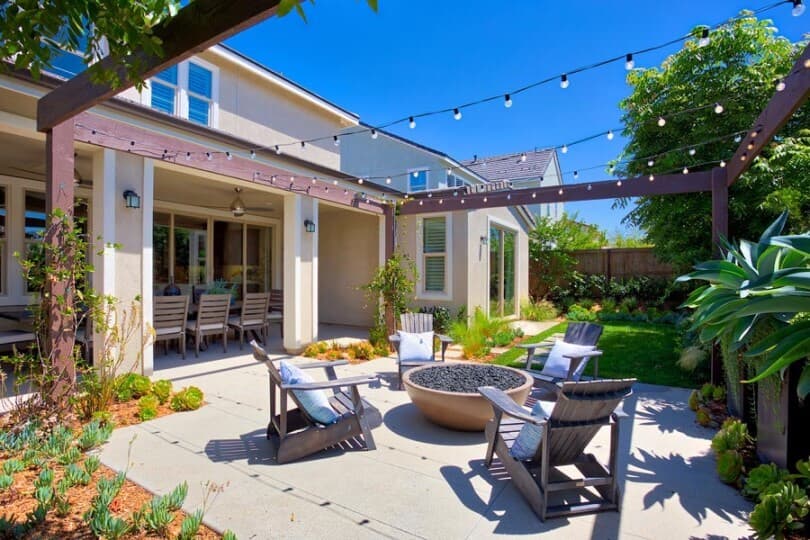 Fire pit and string lights in the back yard of Haciendas Residence 1 by Brookfield Residential in Chula Vista CA