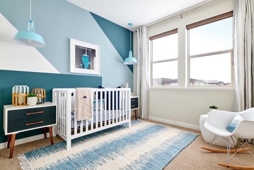 Color block mural wall in a nursery at Fillmore at BLVD by Brookfield Residential in Dublin CA