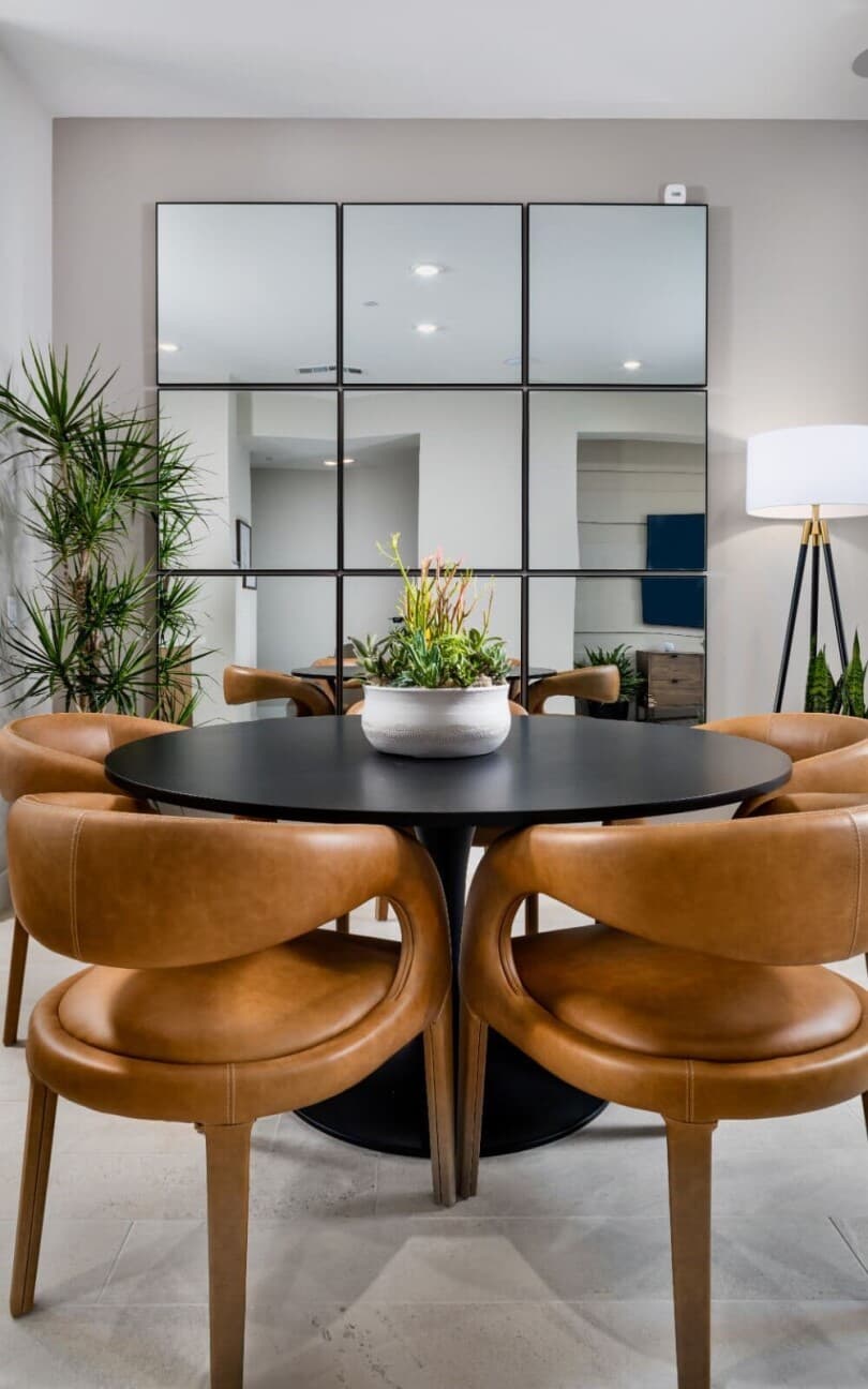 Decorative mirror and dining table in Plan 1 of Luna at The Landing in Tustin, CA