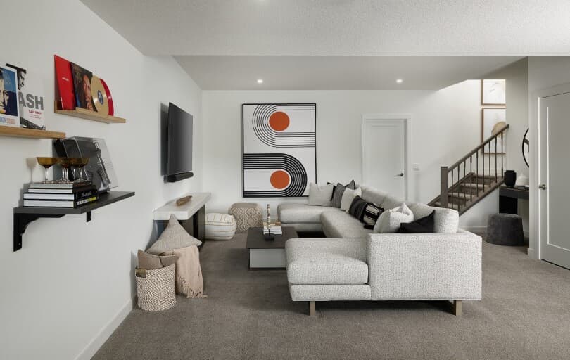Living area in the basement in Columbia at Rockland Park by Brookfield Residential in Calgary