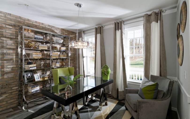 Office with metal bookcases and crystal chandelier in the Prescott at Dowdens Station in Clarksburg, MD