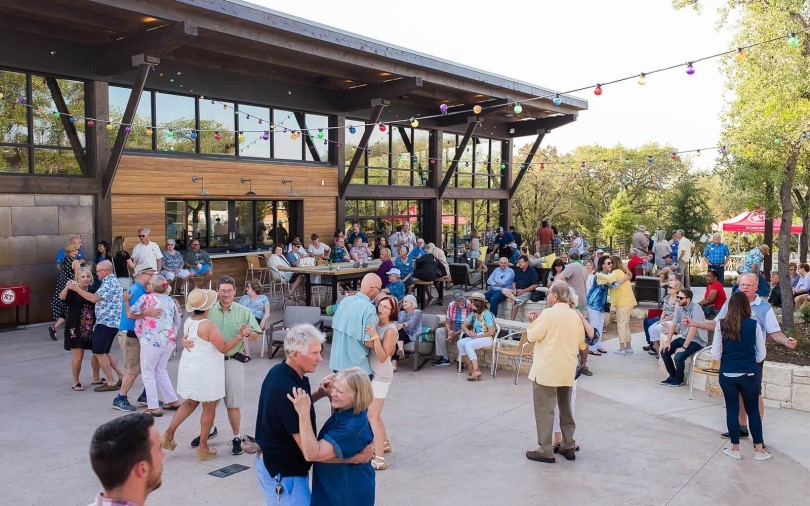 Couples dancing at The Mix amenity center at Kissing Tree in San Marcos TX