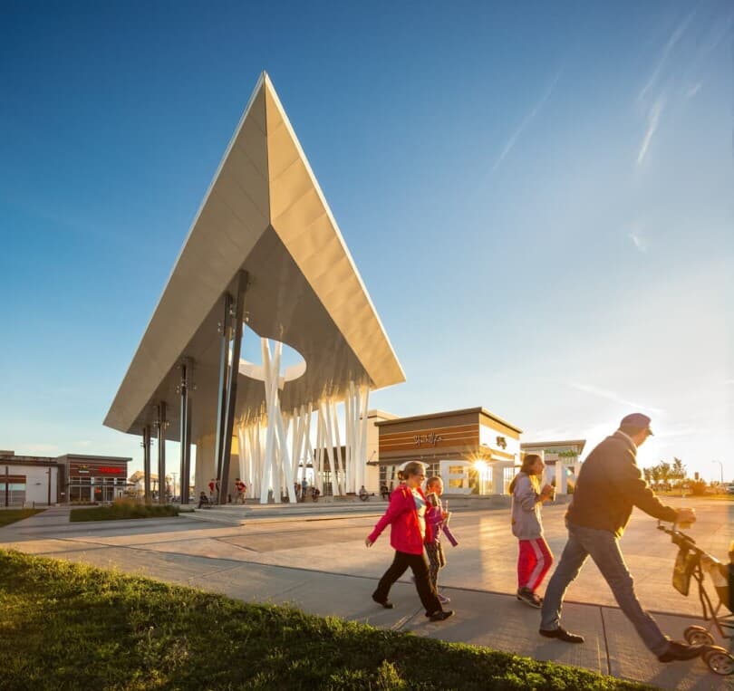 Family walking through the business district at Seton in Calgary AB