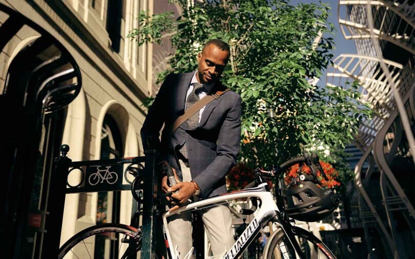 Man locking his bike in Calgary