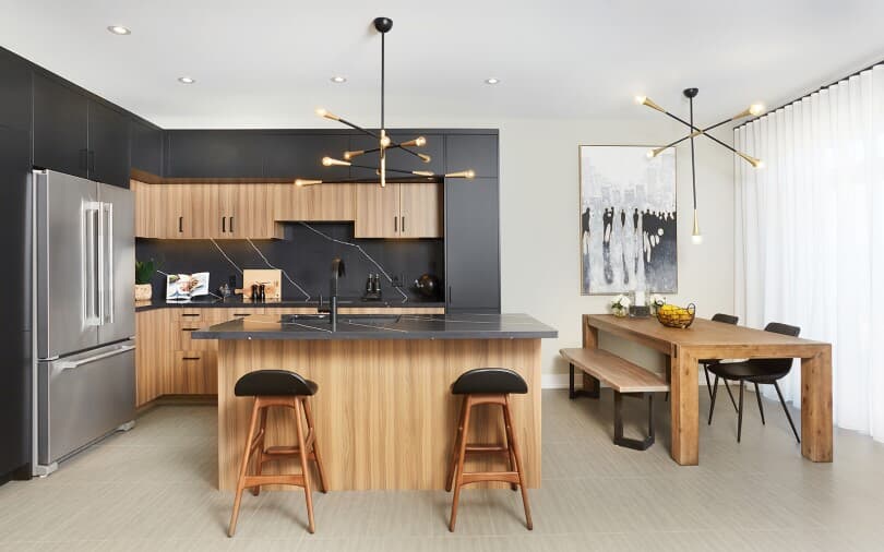 Dramatic black and wood tone kitchen at Midhurst Valley by Brookfield Residential