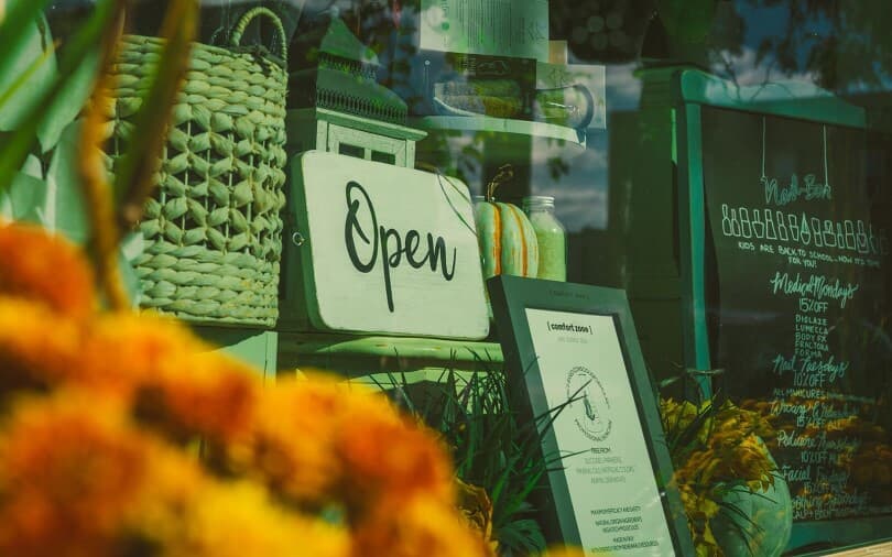 Retail open sign in a window of a shop in Downtown Whitby, ON