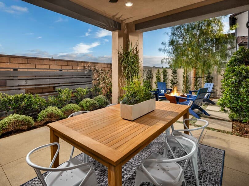 California room with a dining table and succulents in a Brookfield Residential home
