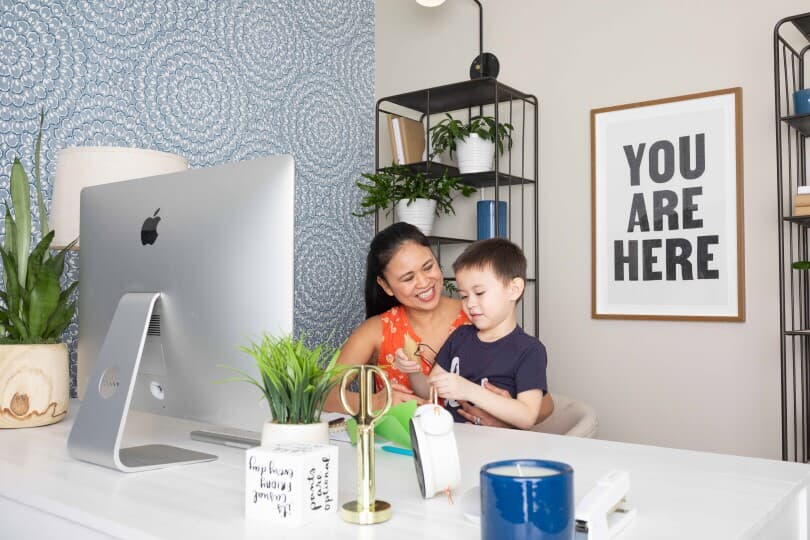 Mother and son sitting a desk in a Brookfield Residential home in Whittier, CA