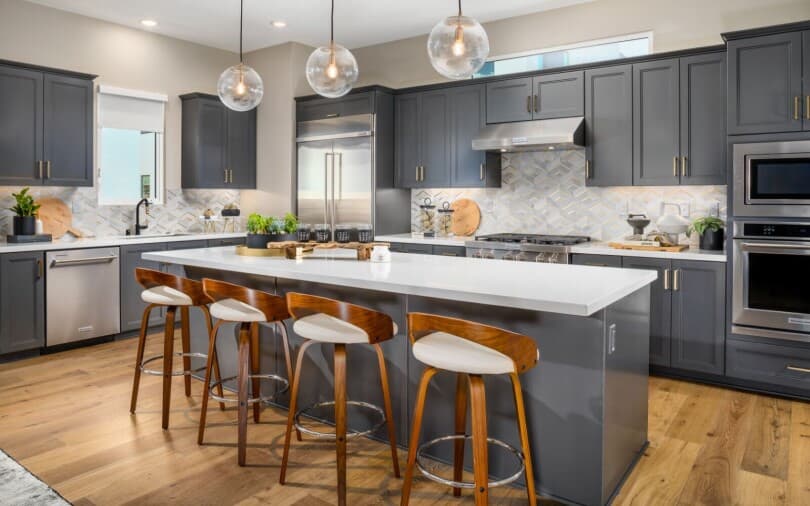 Kitchen with island at Cira Plan 1 at The Landing by Brookfield Residential in Tustin, CA
