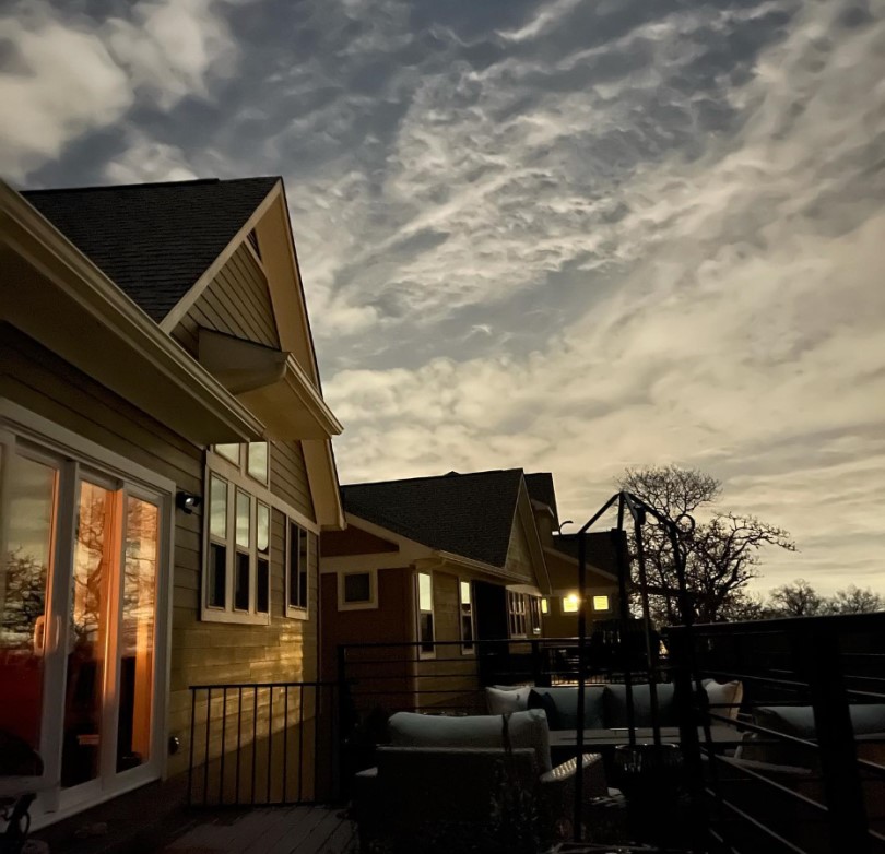 Exterior of Zarina's cottage at dusk at the Cottages at Crystal Falls in Austin, TX