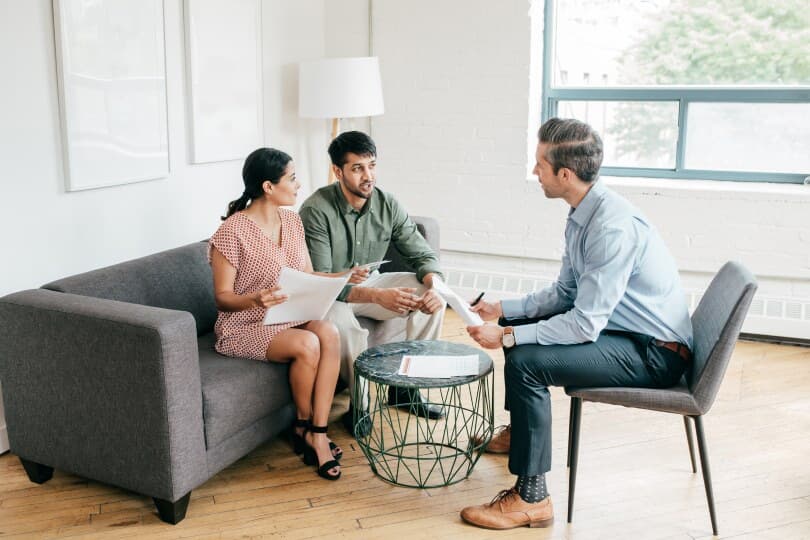 Young couple consults with a financial advisor