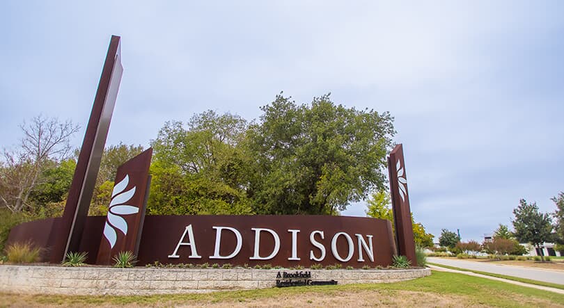 Welcome sign for the Addison community in Austin Texas.