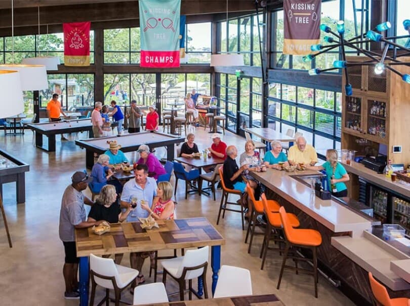 Neighbors eating and drinking at Independence Hall at Kissing Tree in San Marcos, TX