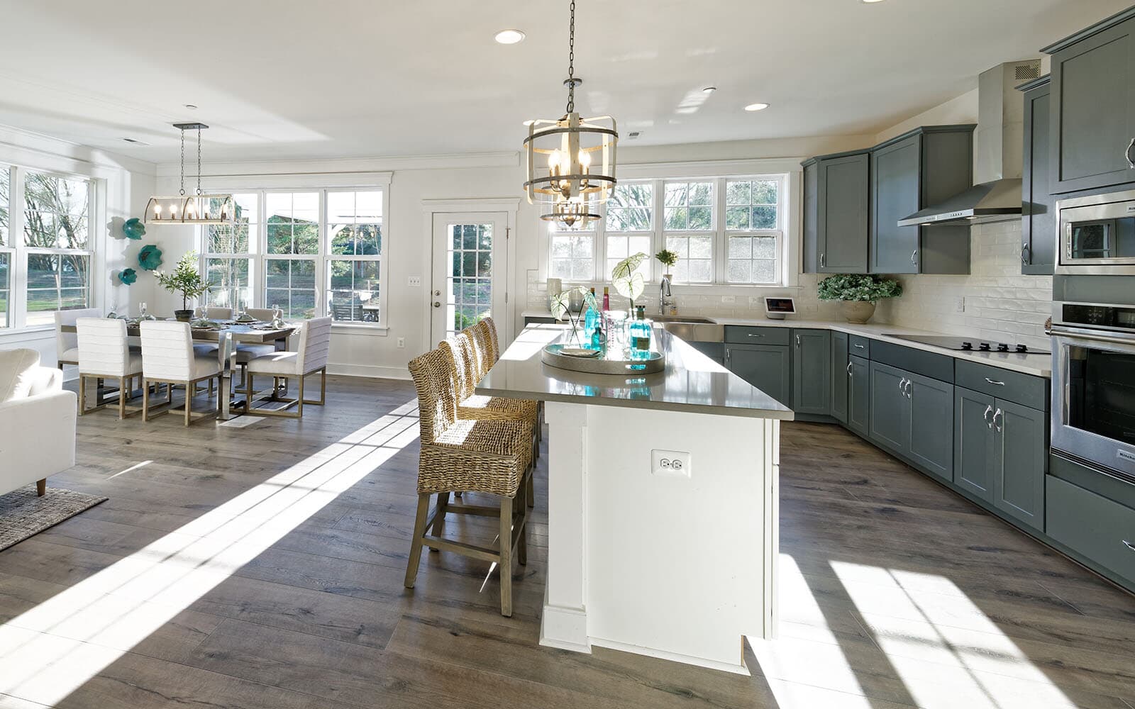 The kitchen open to the grand room in the Beckham. by Brookfield Residential