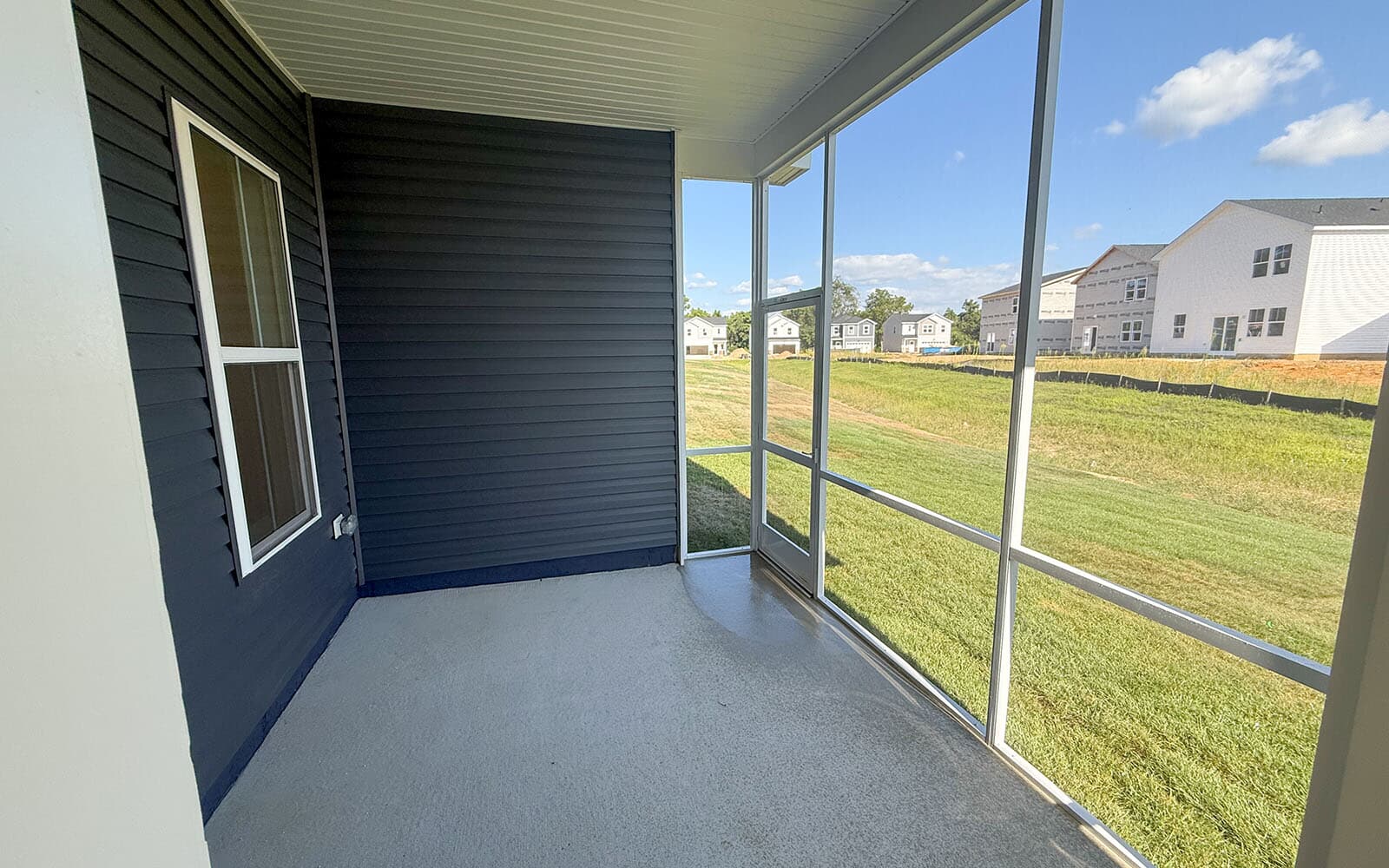 The rear screened porch of the Matisse on homesite 1132 at Lakeside at Trappe by Brookfield Residential.