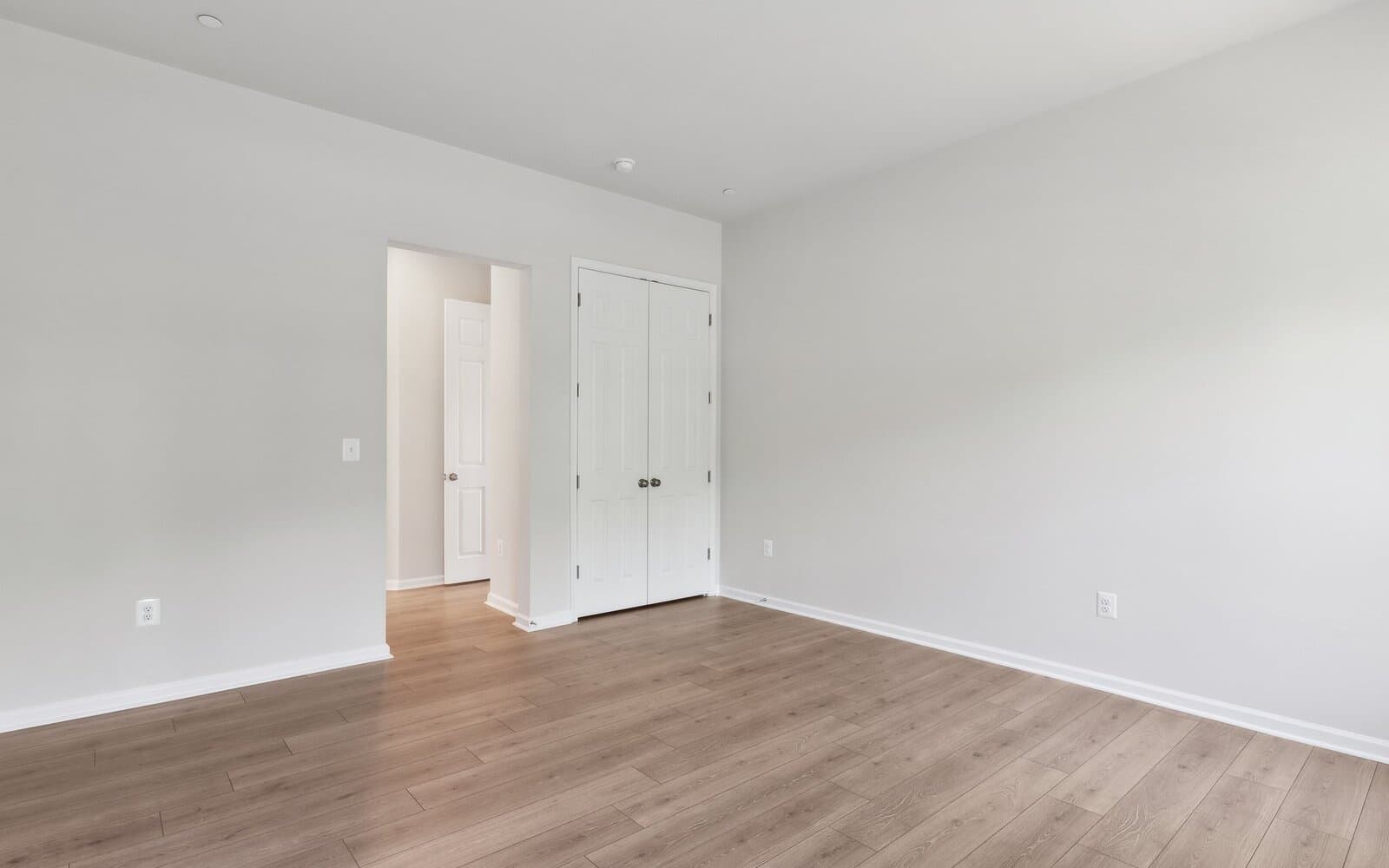 The main level primary bedroom of the Douglas on homesite 1005 at Lakeside at Trappe.
