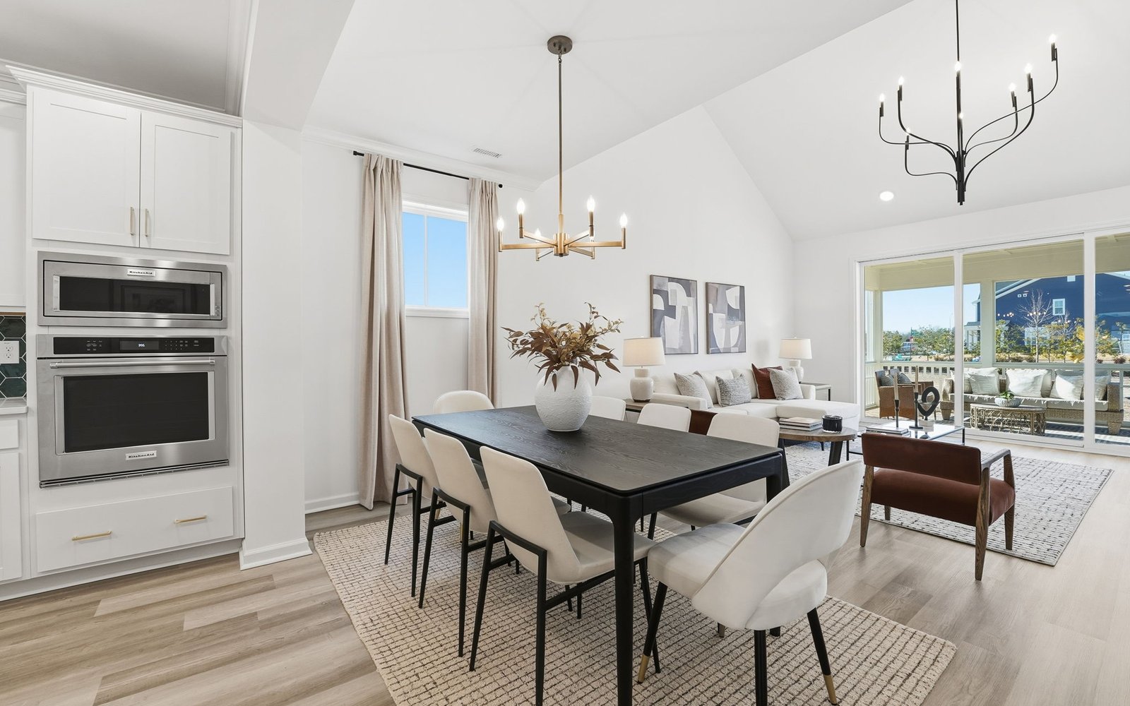 The dining room and great room of the Delaney by Brookfield Residential.
