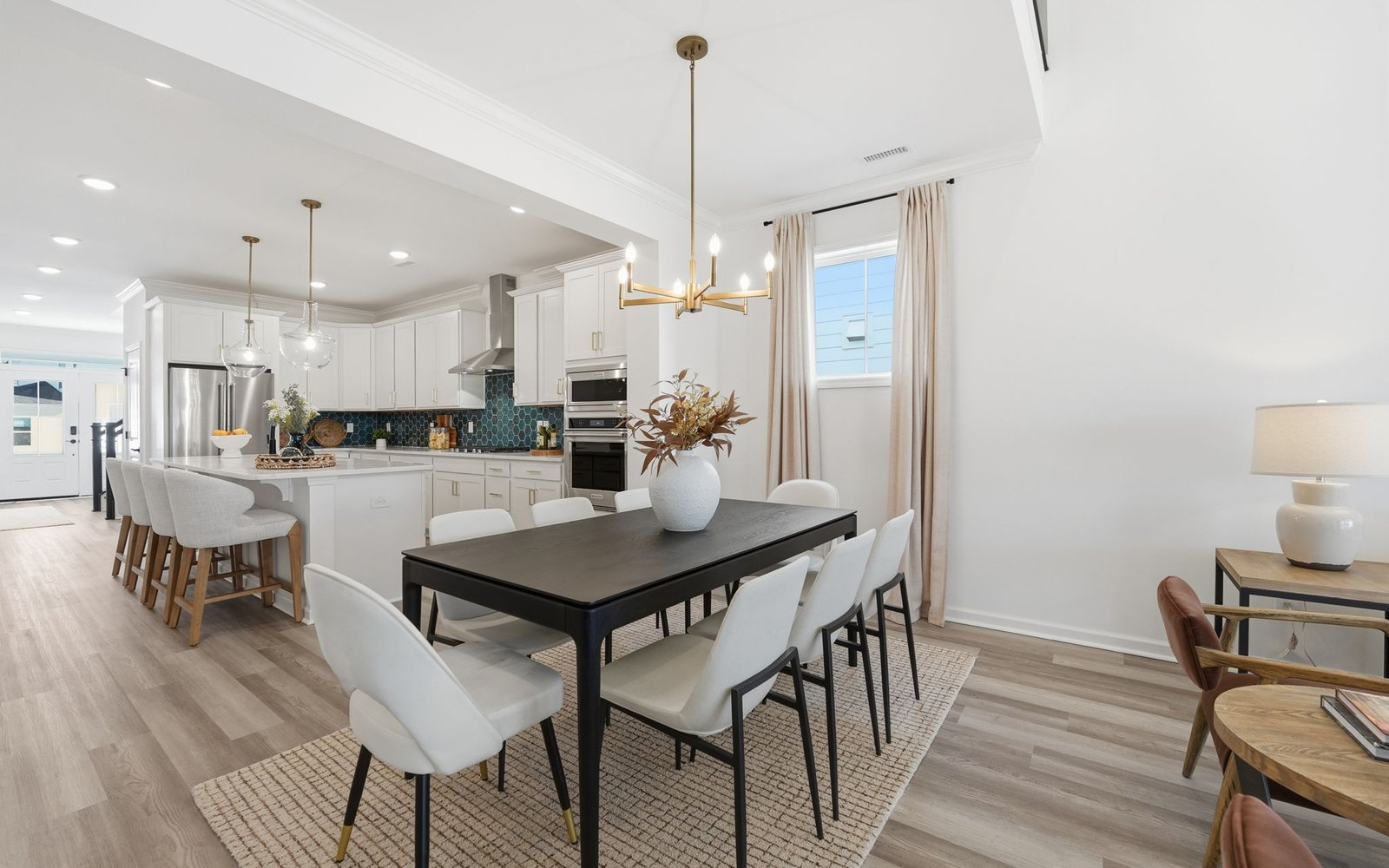 The dining room and kitchen of the Delaney by Brookfield Residential.
