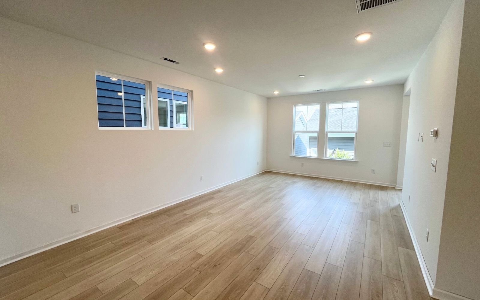 The family room in the Carter by Brookfield Residential at Wendell Falls.