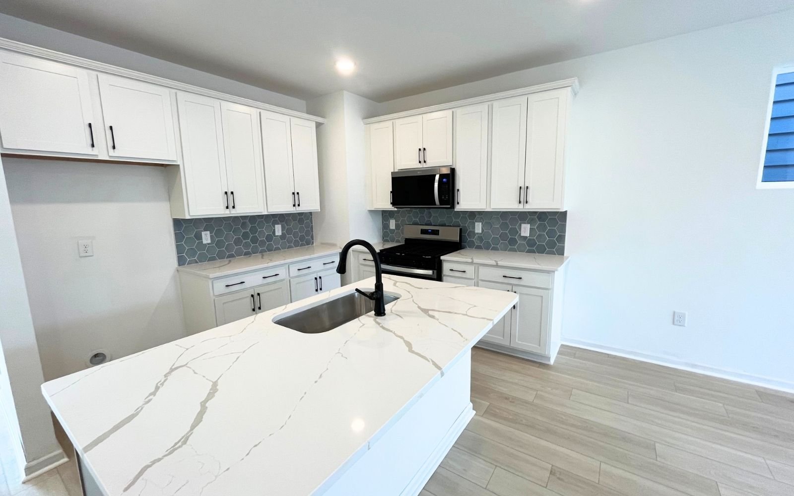 The kitchen of the Carter by Brookfield Residential at Wendell Falls.