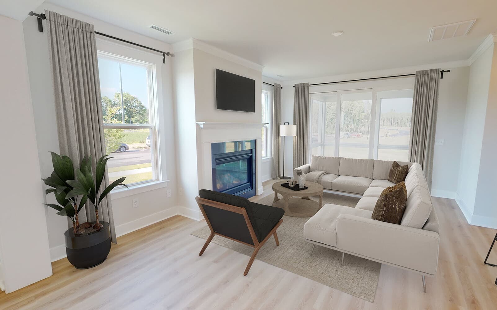 The great room of the Mason by Brookfield Residential