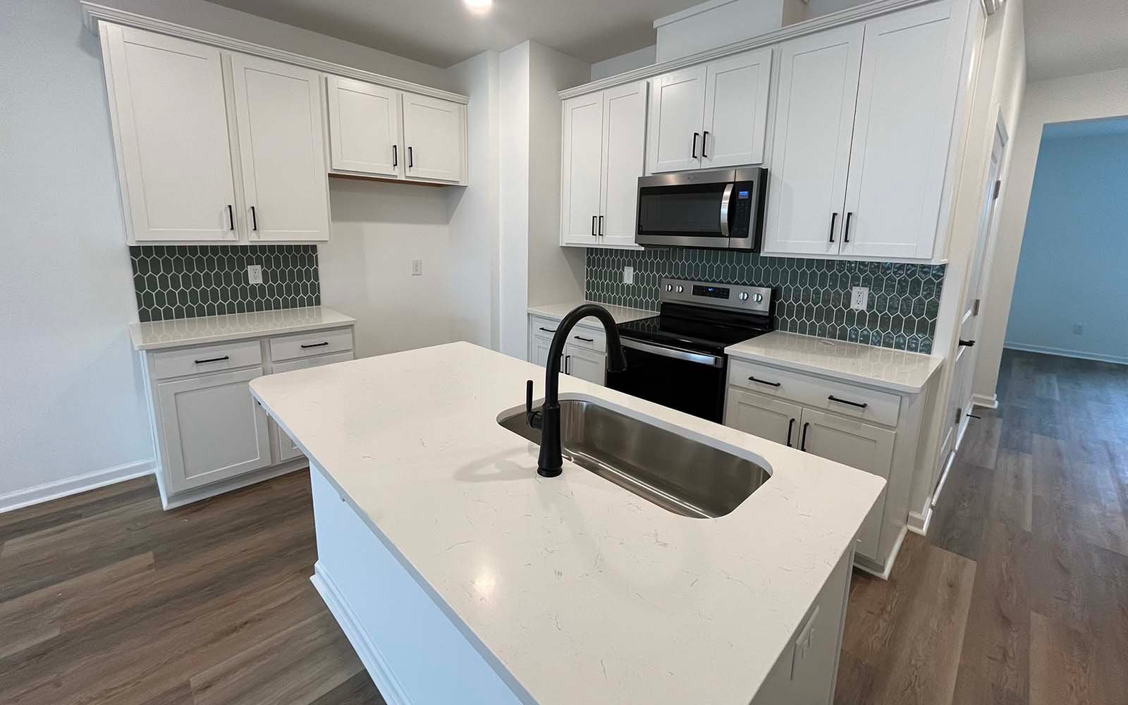 The kitchen of the Lennox on homesite 2550 by Brookfield Residential at Wendell Falls.