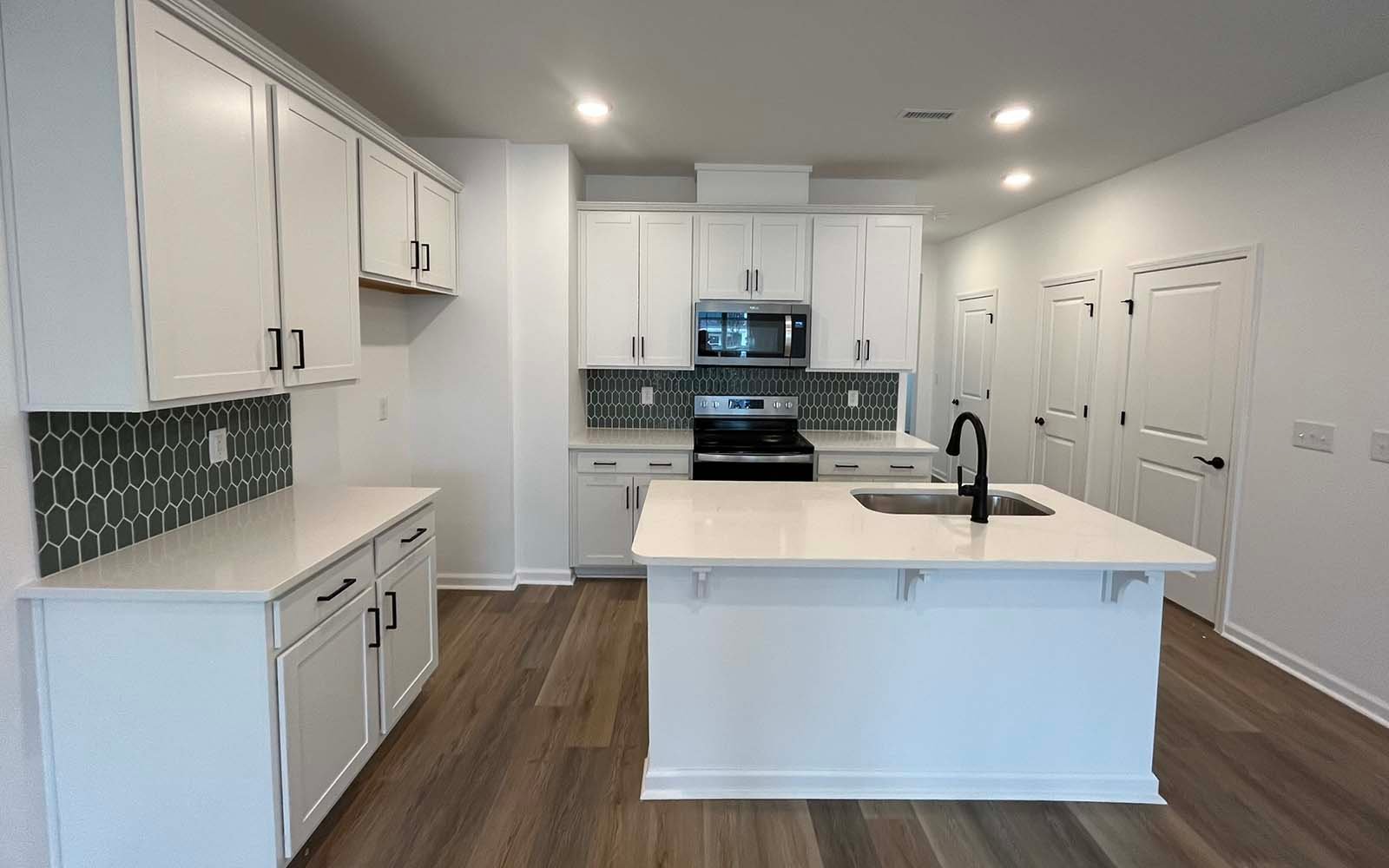 The kitchen of the Lennox on homesite 2550 by Brookfield Residential at Wendell Falls.