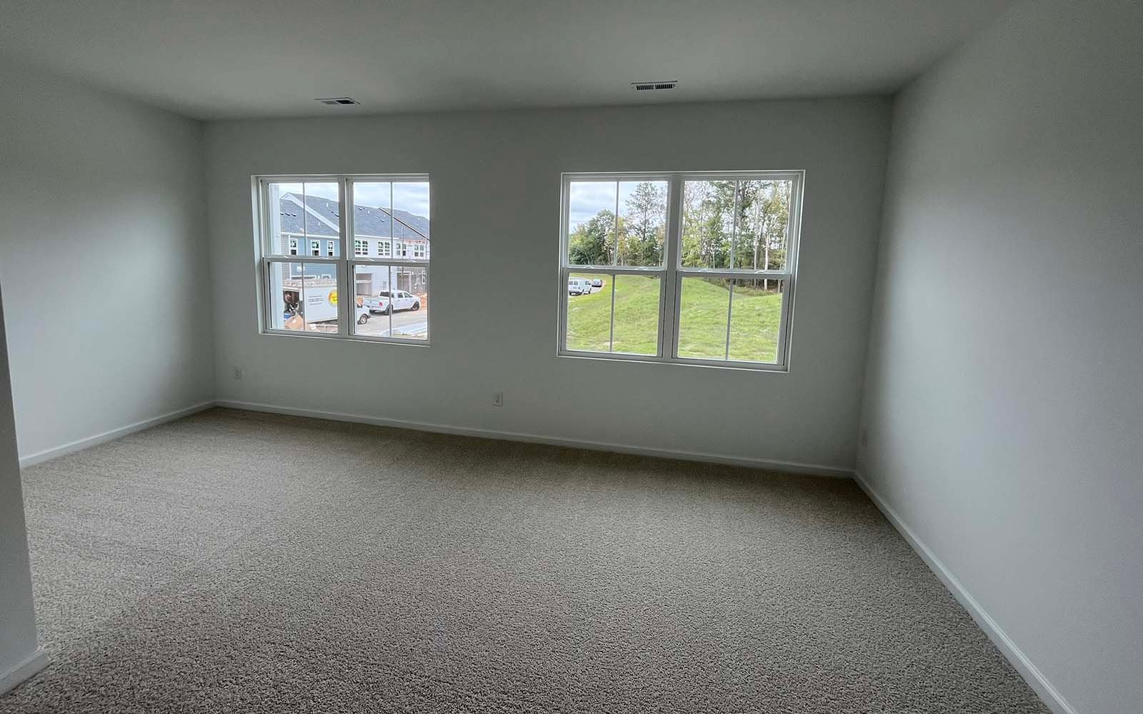 The primary bedroom of the Lennox on homesite 2550 by Brookfield Residential at Wendell Falls.