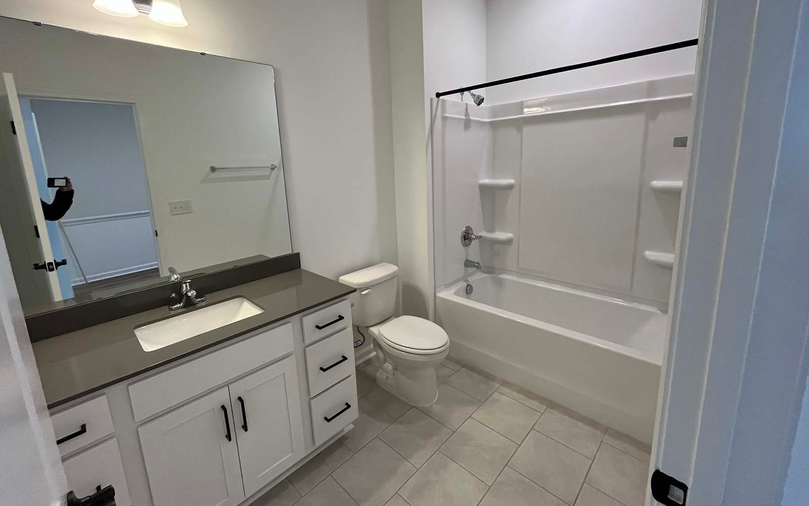 A secondary bathroom of the Lennox on homesite 2550 by Brookfield Residential at Wendell Falls.