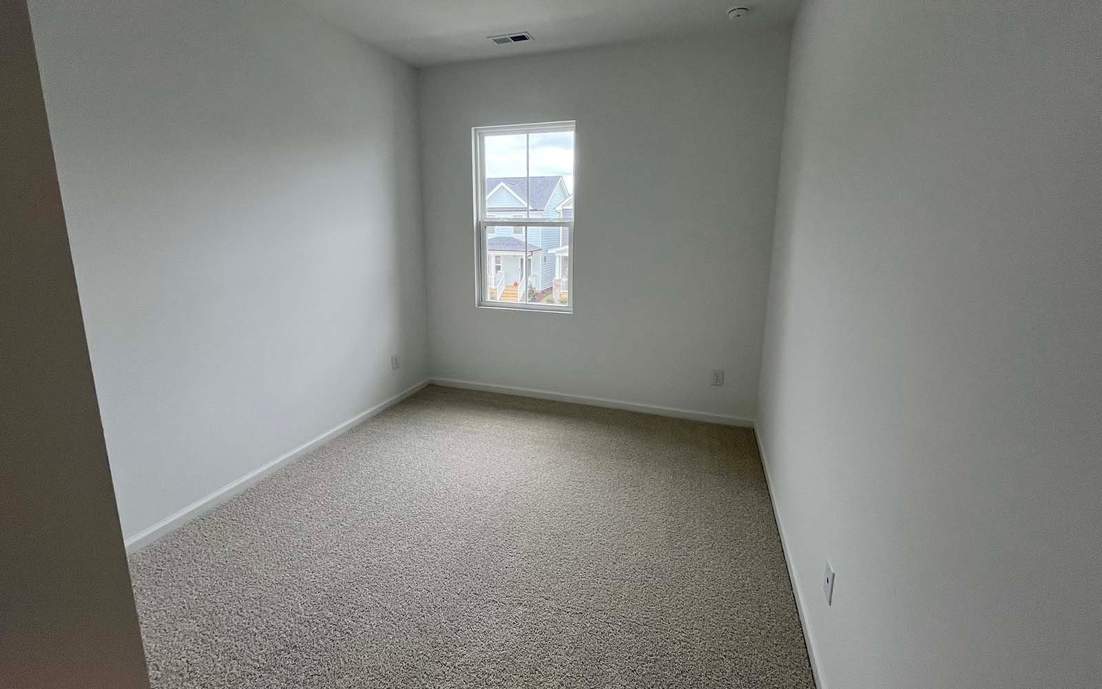 A secondary bedroom of the Lennox on homesite 2550 by Brookfield Residential at Wendell Falls.