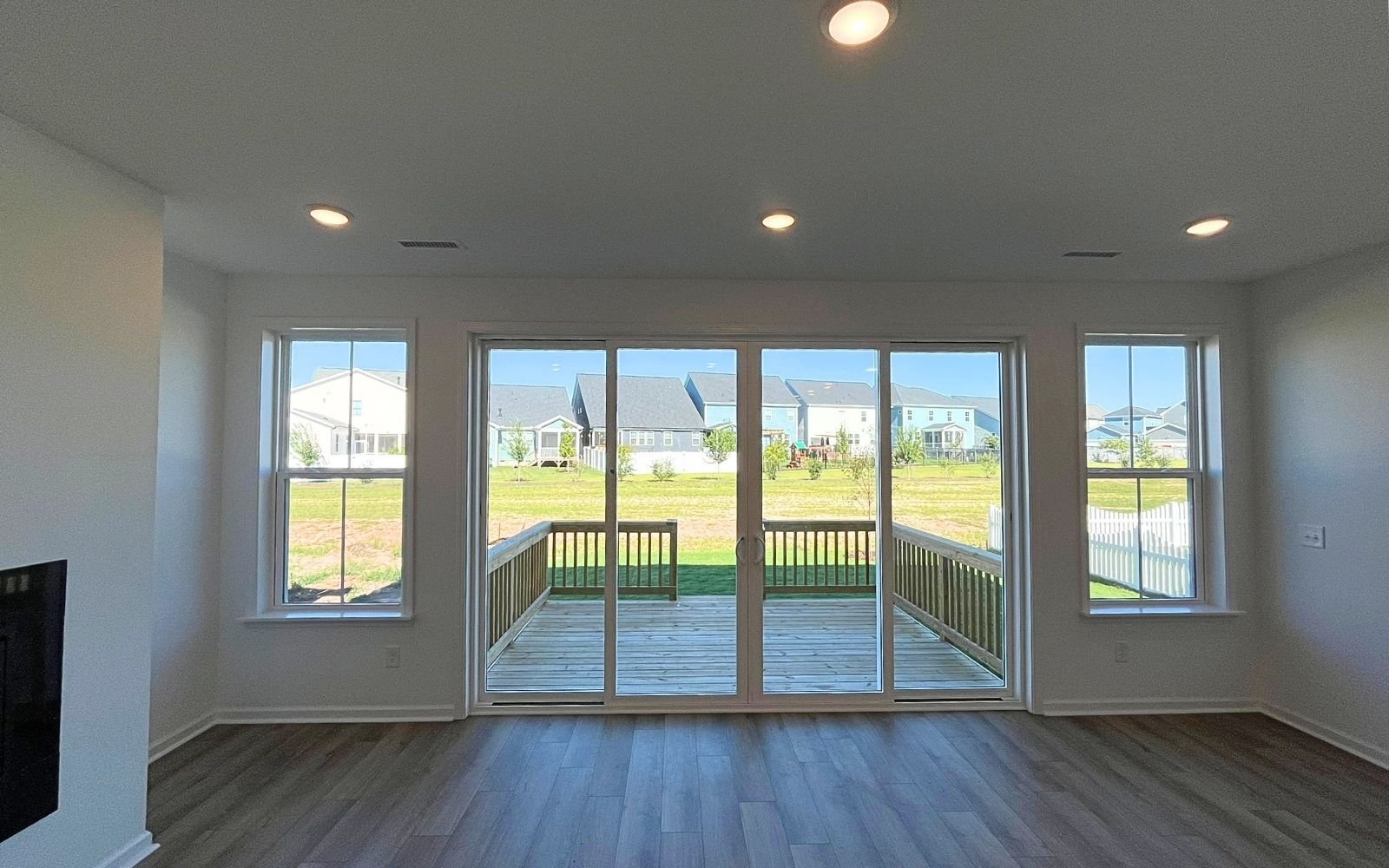 The family room and deck of the Grayson at Wendell Falls.