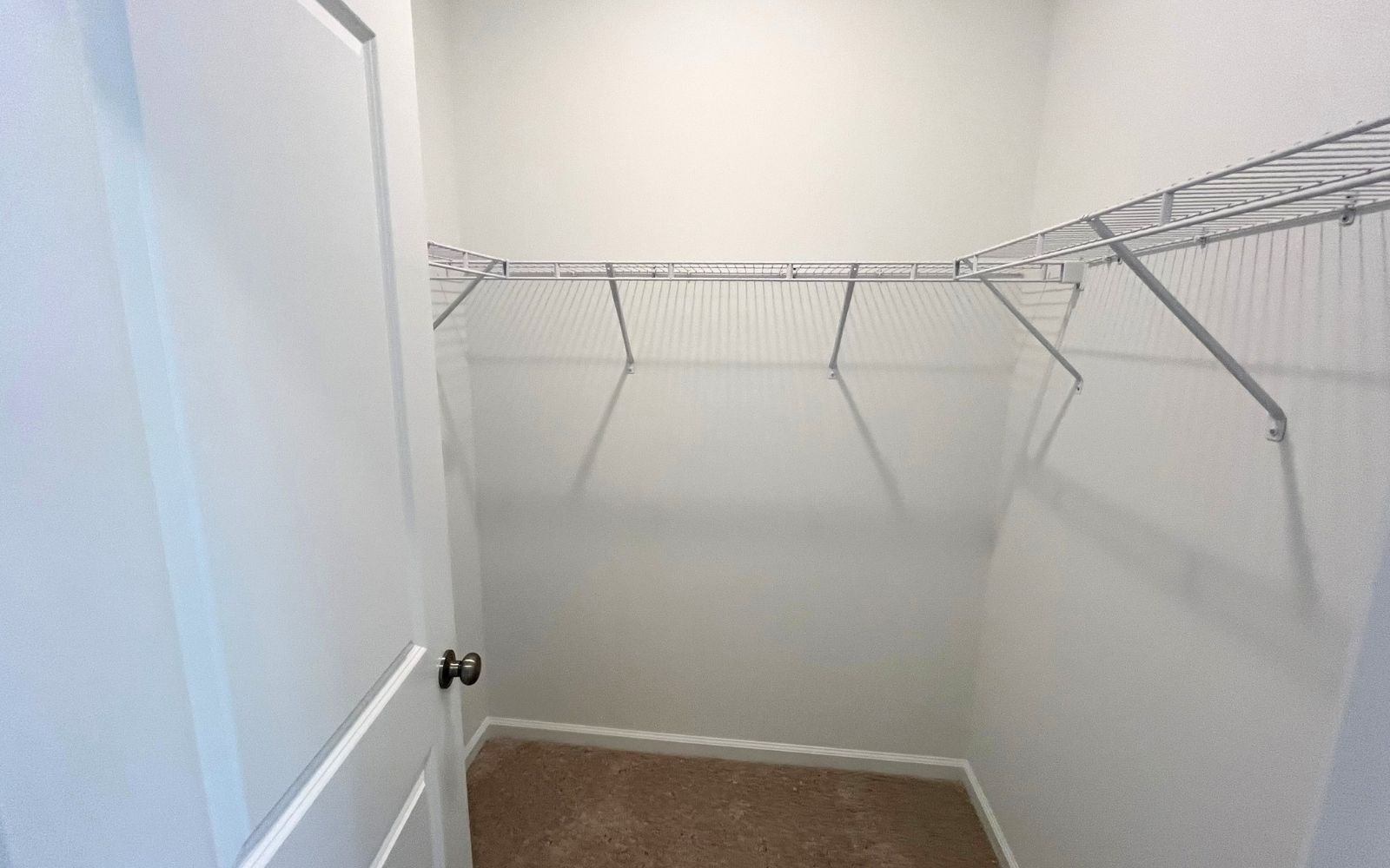 A walk-in closet in the Lennox on homesite 2566 at Wendell Falls.