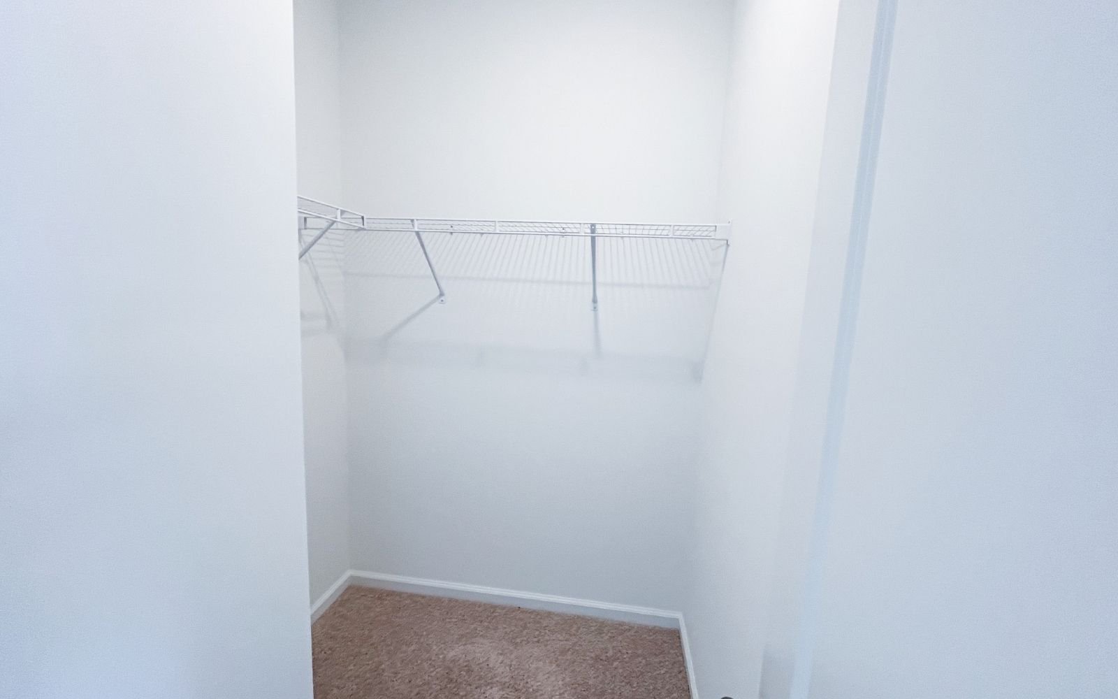 A walk-in closet in the Lennox on homesite 2575 by Brookfield Residential.