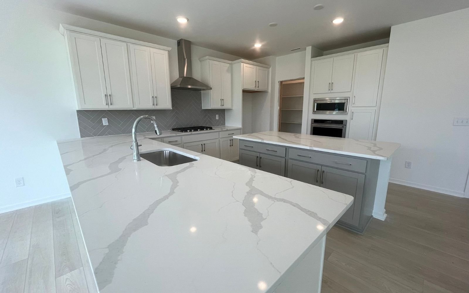The kitchen of the Sterling on homesite 2436 by Brookfield Residential at Wendell Falls.