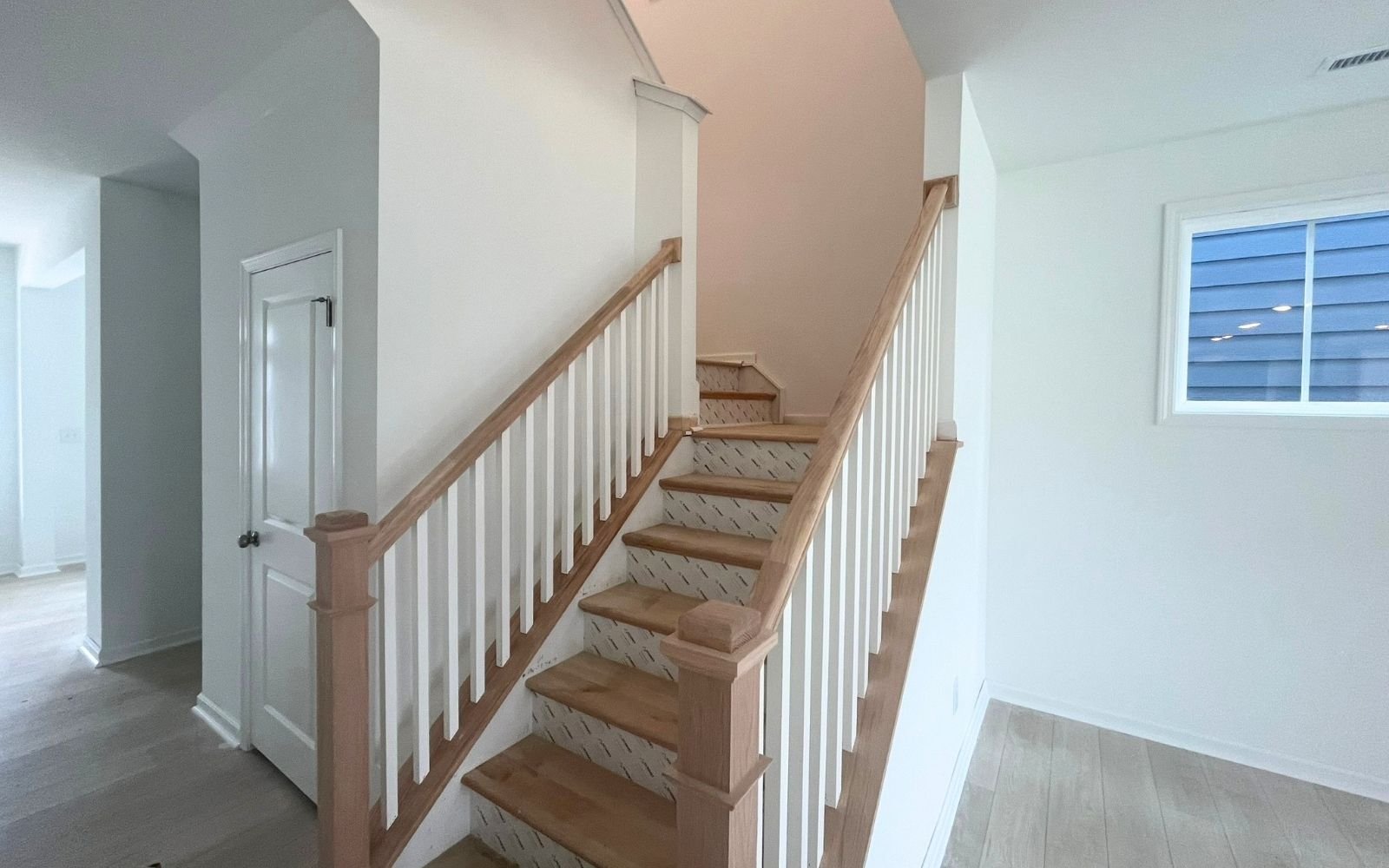 The stairs to the upper level in the Sterling on homesite 2436 by Brookfield Residential at Wendell Falls.