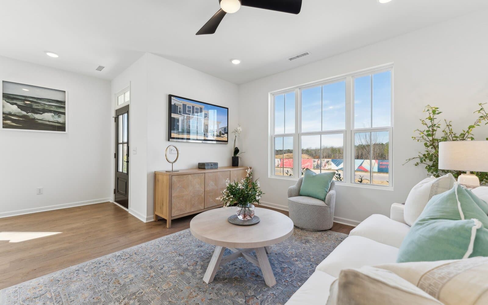 The family room of the Morgan townhome model by Brookfield Residential at Wendell Falls.
