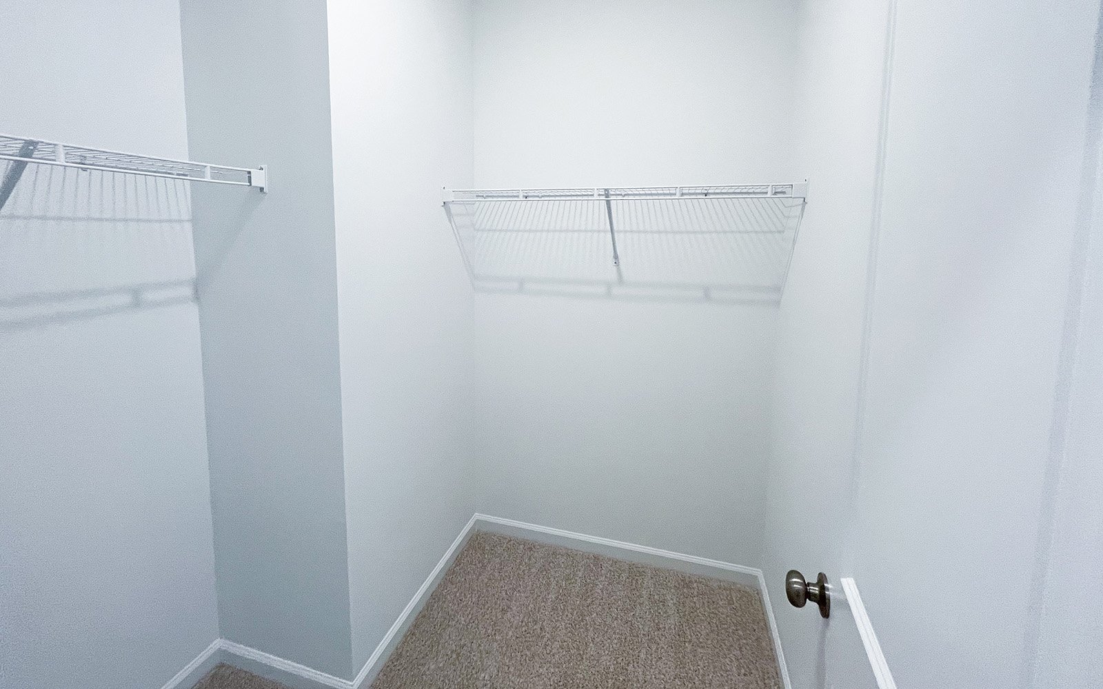 A walk-in closet in the Morgan on homesite 2548 by Brookfield Residential at Wendell Falls.