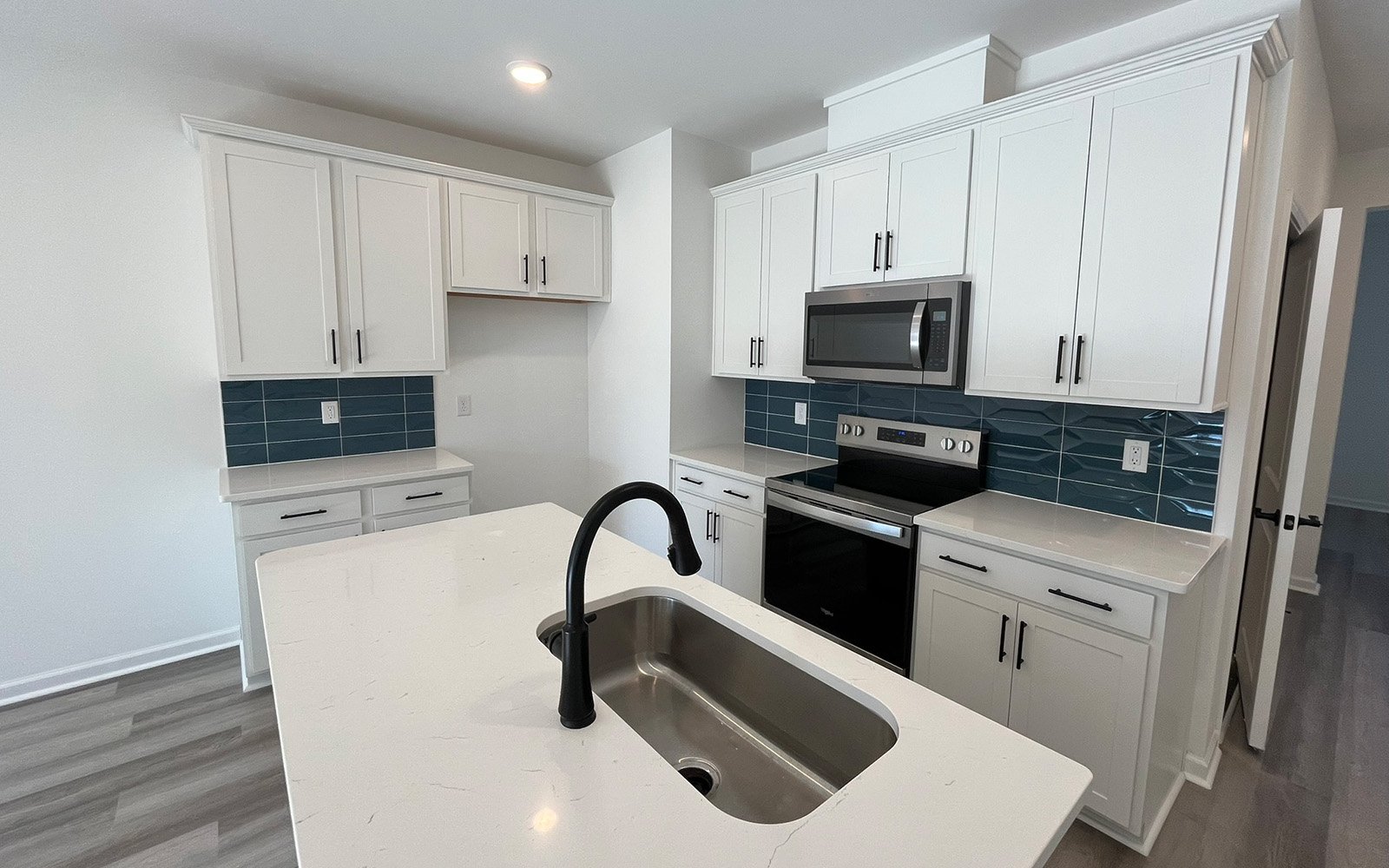 The kitchen in the Lennox on homesite 2554 by Brookfield Residential at Wendell Falls.